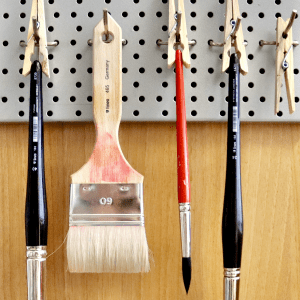 Artist brushes hanging to dry after washing